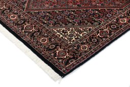 Backside of handmade New Bijar rug showing knot structure and weave density