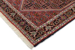 Backside of handmade New Bijar rug showing knot structure and weave density