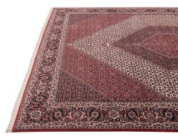 Backside of handmade New Bijar rug showing knot structure and weave density