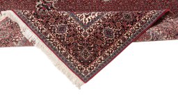 Backside of handmade New Bijar rug showing knot structure and weave density