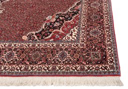 Backside of handmade New Bijar rug showing knot structure and weave density