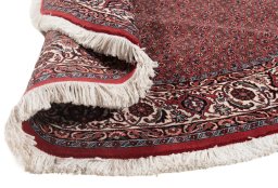 Backside of handmade New Bijar rug showing knot structure and weave density