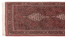 Corner detail of New Bijar rug showing border pattern and Wool pile