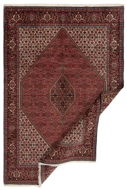 Backside of handmade New Bijar rug showing knot structure and weave density