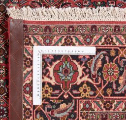 Backside of handmade New Bijar rug showing knot structure and weave density