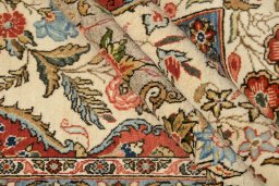 Corner detail of 1960s Ghom rug showing border pattern and Wool pile