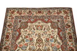 Surface texture of 1960s Ghom rug with natural Wool and intricate pattern
