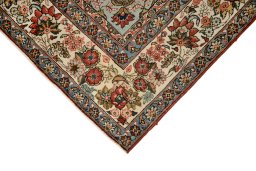 Backside of handmade 1960s Ghom rug showing knot structure and weave density