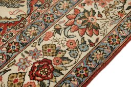 Close-up detail of 1960s Ghom rug from Iran / Persia showing Wool weave