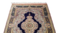 Surface texture of New Ghom rug with natural Silk and intricate pattern