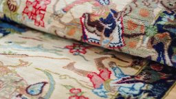 Central medallion detail of New Ghom rug from Iran / Persia