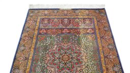Surface texture of New Ghom rug with natural Silk and intricate pattern