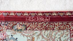 Backside of handmade New Ghom rug showing knot structure and weave density