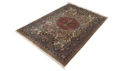 Corner detail of 1970s Ghom rug showing border pattern and Wool pile
