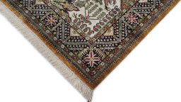 Backside of handmade 1970s Ghom rug showing knot structure and weave density
