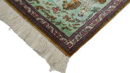 Surface texture of 1980s Ghom rug with natural Silk and intricate pattern