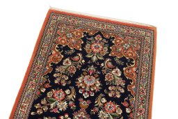 Surface texture of 1990s Ghom rug with natural Wool and intricate pattern