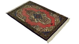 Corner detail of 1990s Ghom rug showing border pattern and Wool pile