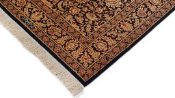 Backside of handmade New Ghom rug showing knot structure and weave density