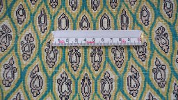 Surface texture of 1990s Ghom rug with natural Silk and intricate pattern
