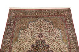 Surface texture of 1980s Ghom rug with natural Wool and intricate pattern