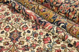 Close-up detail of 1980s Ghom rug from Iran / Persia showing Wool weave