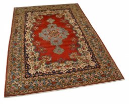 Corner detail of 1950s Ghom rug showing border pattern and Cork pile