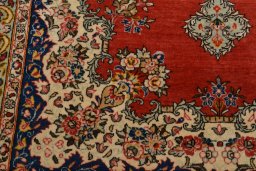 Backside of handmade 1950s Ghom rug showing knot structure and weave density