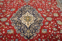 Corner detail of 1970s Ghom rug showing border pattern and Wool pile