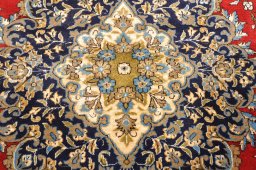 Corner detail of 1970s Ghom rug showing border pattern and Wool pile