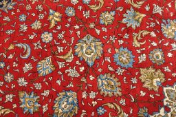 Surface texture of 1970s Ghom rug with natural Wool and intricate pattern