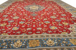Full view of 1970s Ghom rug from Iran / Persia, 414 × 305 cm in Red tones