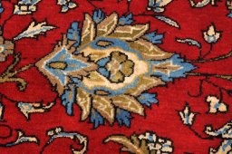 Surface texture of 1970s Ghom rug with natural Wool and intricate pattern