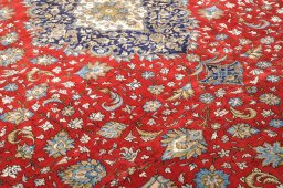 Backside of handmade 1970s Ghom rug showing knot structure and weave density