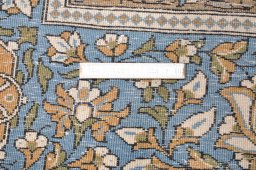Backside of handmade 1970s Ghom rug showing knot structure and weave density
