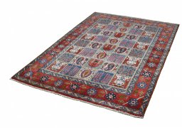 Close-up detail of 1950s Ghom rug from Iran / Persia showing Wool weave