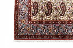 Backside of handmade 1950s Ghom rug showing knot structure and weave density