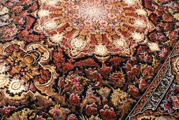 Backside of handmade New Ghom rug showing knot structure and weave density