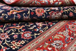 Surface texture of 2000s Ghom rug with natural Cork and intricate pattern