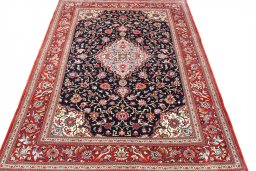 Surface texture of 2000s Ghom rug with natural Cork and intricate pattern