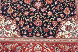 Backside of handmade 2000s Ghom rug showing knot structure and weave density