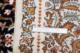 Backside of handmade New Ghom rug showing knot structure and weave density