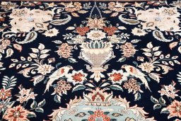 Close-up detail of New Ghom rug from Iran / Persia showing Wool weave