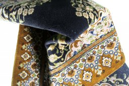 Close-up detail of 2000s Ghom rug from Iran / Persia showing Cork weave
