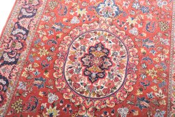 Backside of handmade New Ghom rug showing knot structure and weave density