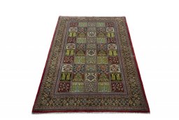 Surface texture of 2000s Ghom rug with natural Wool and intricate pattern