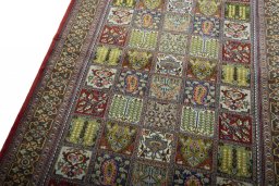 Backside of handmade 2000s Ghom rug showing knot structure and weave density