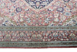 Corner detail of 1970s Ghom rug showing border pattern and Silk pile
