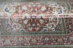 Close-up detail of 1970s Ghom rug from Iran / Persia showing Silk weave