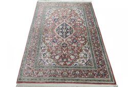Surface texture of 1970s Ghom rug with natural Silk and intricate pattern